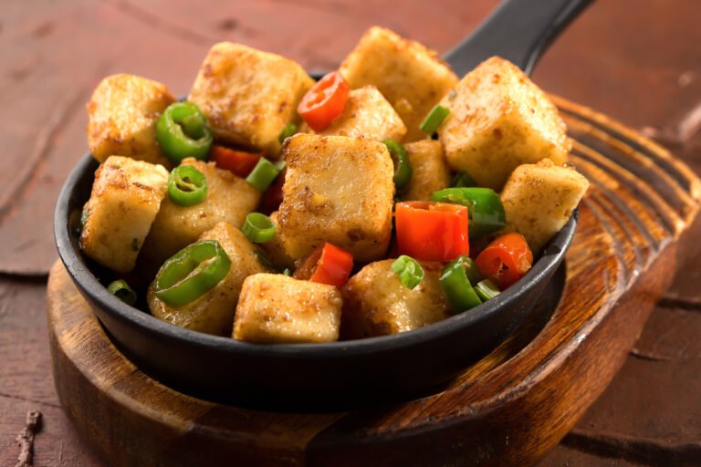 Mapo Tofu with spring onion and red pepper served in dish isolated on background side view of chinese food