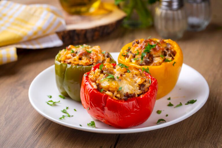 Stuffed peppers, halves of peppers stuffed with rice, dried toma