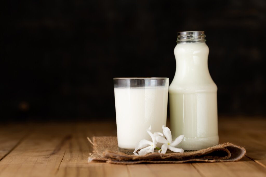 Two glass of milk on a wooden table