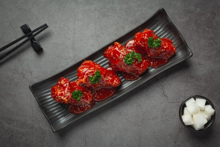 Korean Spicy Fried Chicken on a black long tray